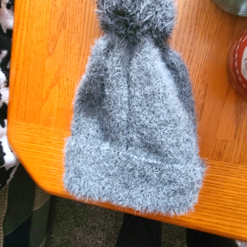 A Very Stylish Grey Pom Hat.  It is from magnolia boutique.